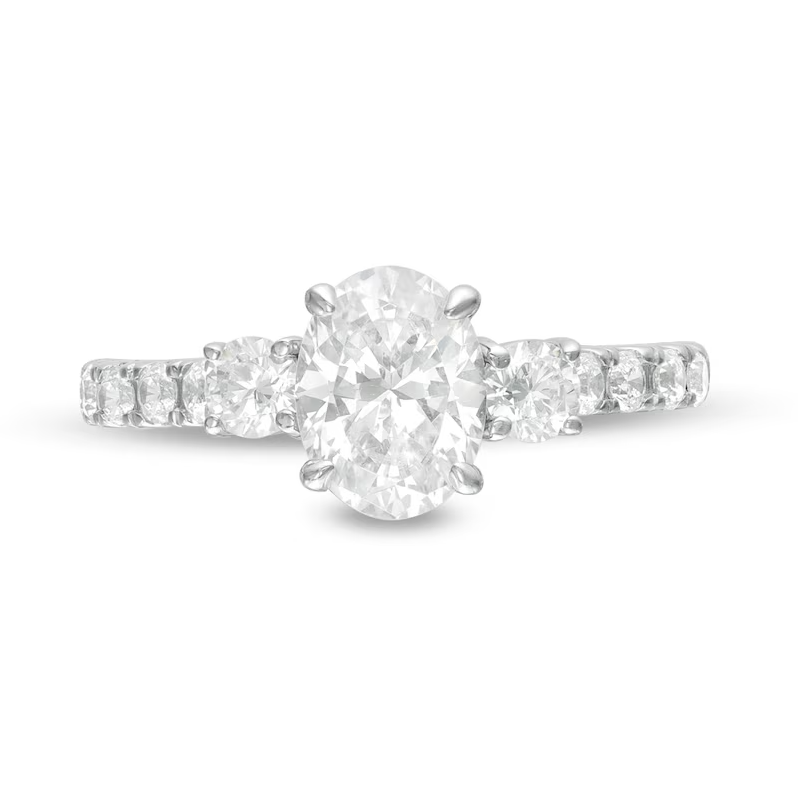 1-3/4 CT. T.W. Oval and Round Diamond Three Stone Engagement Ring in 14K White Gold